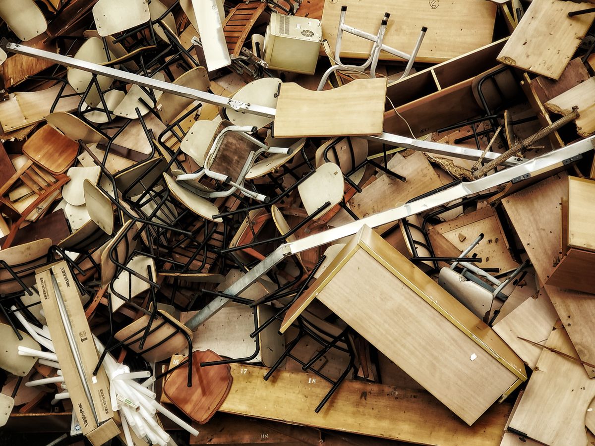 A pile of old furniture and chairs cleared for furniture disposal in Singapore