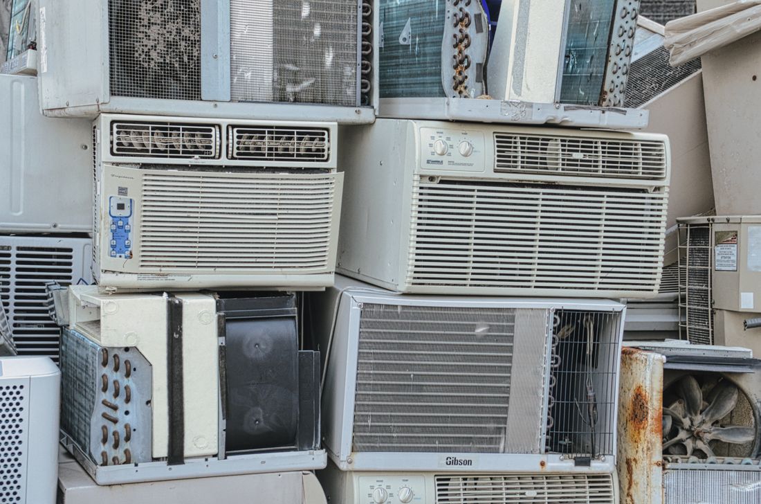 Old appliances and electronics sorted for recycling and e-waste disposal