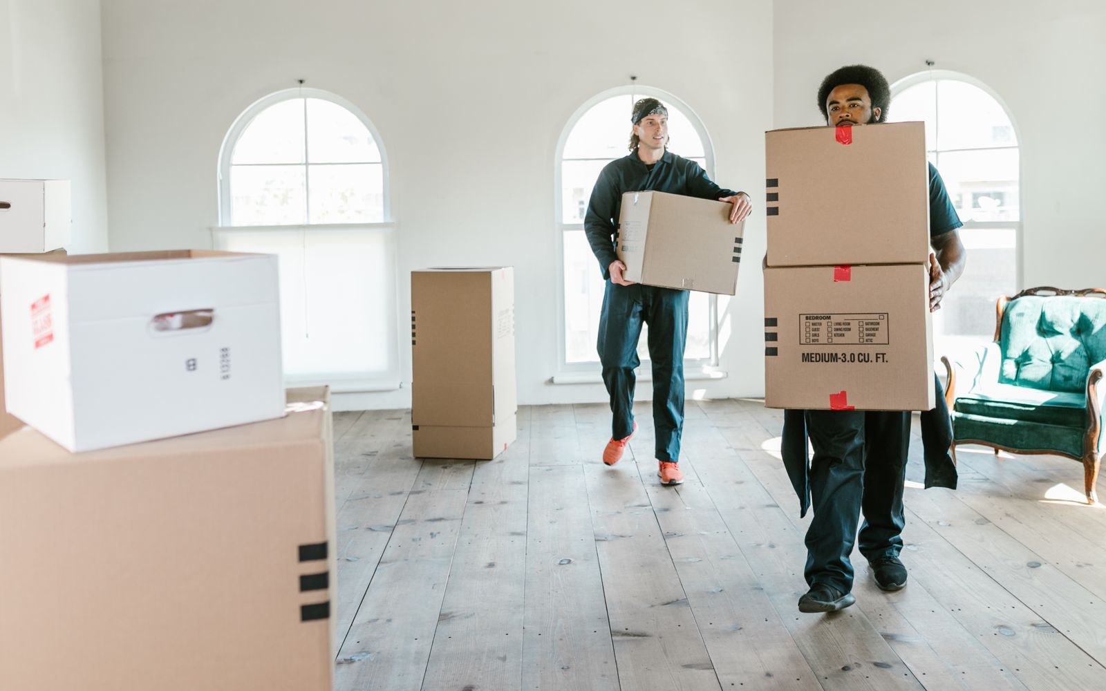 Relo moving crew carrying boxes on an office move in Singapore